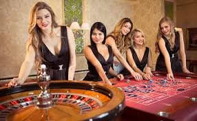 Mobile phone displaying live casino lobby with multiple game options
